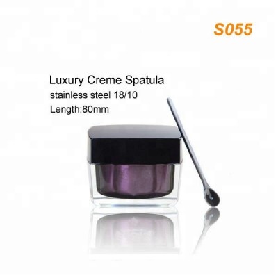 luxury silver stainless steel face cream spoon along with cosmetic cream jars